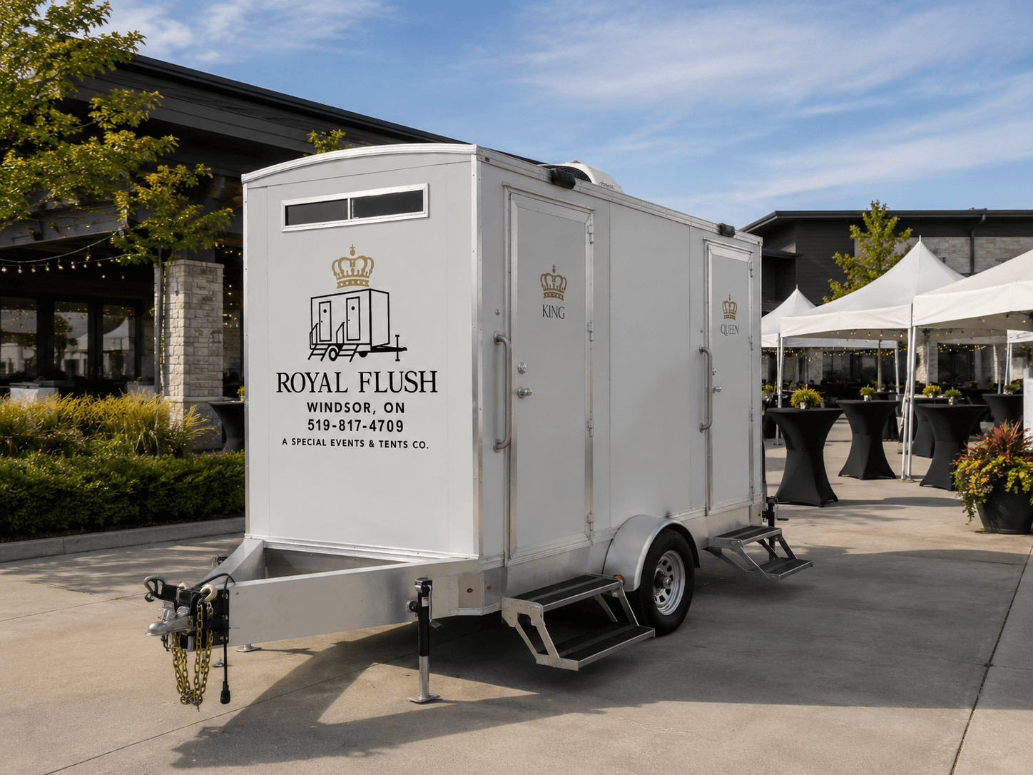 Royal Flush Windsor restroom trailer at a corporate event venue alongside catering tents and cocktail tables